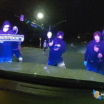 wild-video-shows-masked-ruffians-attacking-police-cruiser-with-officer-inside-during-illegal-street-takeover