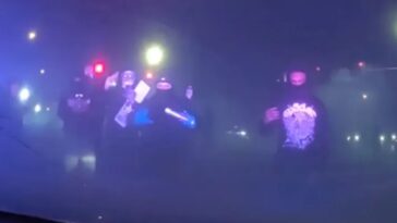 masked-mob-attacks-police-cruiser-with-officer-inside-during-illegal-street-takeover