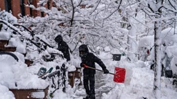 northeast-us.-rushes-to-clear-piles-of-snow-as-fresh-storm-approaches