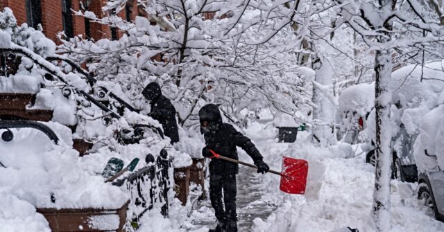 northeast-us.-rushes-to-clear-piles-of-snow-as-fresh-storm-approaches