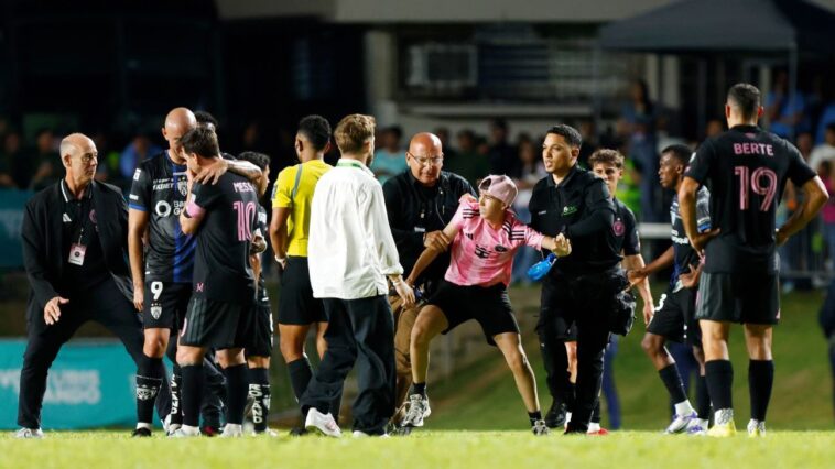 messi-knocked-to-ground-as-fans-invade-field-in-pr