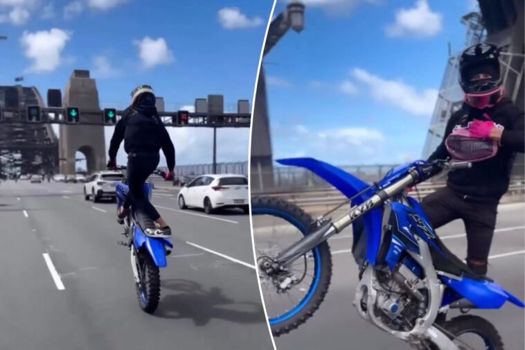 chilling-footage-shows-dirt-bike-rider’s-‘reckless’-act-on-busy-bridge:-‘death-defying-stunts’