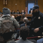 ‘you-should-be-ashamed!’:-protester-dragged-from-kristi-noem’s-senate-hearing
