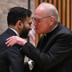 cardinal-timothy-dolan-chummily-whispers-into-mamdani’s-ear-at-nypd-event-—-as-ex-archbishop-said-he-was-‘ticked-off’-at-mayoral-snubs