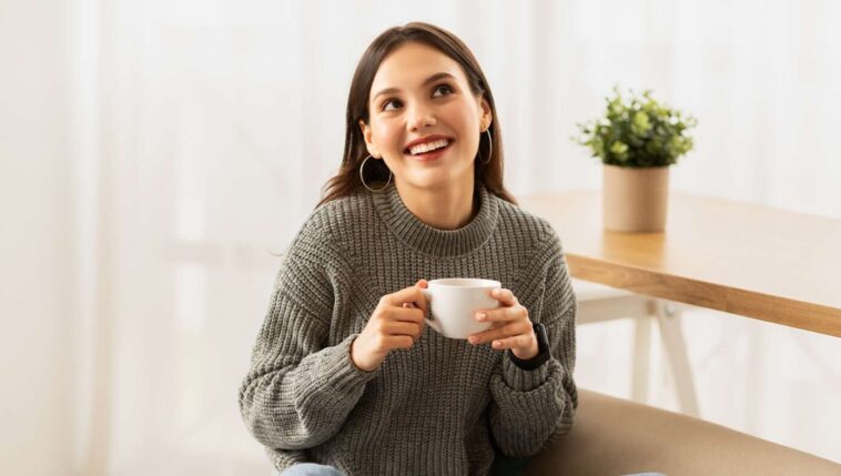 ‘mmm,-i-love-coffee,’-says-woman-drinking-chocolate-milk-with-single-drop-of-espresso