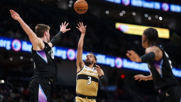 despite-rust,-young-dazzles-wiz-crowd-in-debut