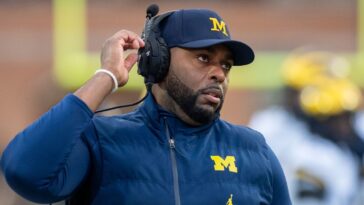 fired-michigan-coach-moore-reaches-plea-deal