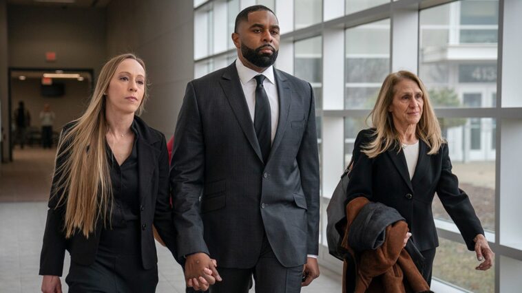 ex-michigan-football-coach-sherrone-moore-walks-into-court-hand-in-hand-with-wife-ahead-of-latest-hearing