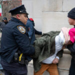 watch:-man-is-pummeled-by-khamenei-mourners-in-nyc-after-snatching-poster-of-‘supreme-leader’