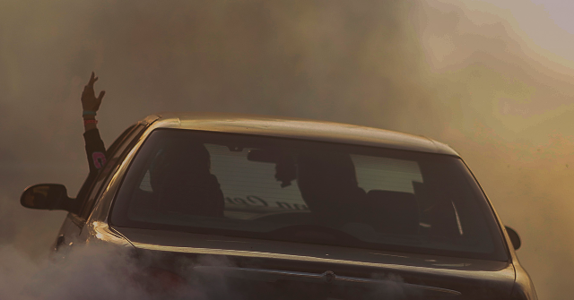 watch:-woman-allegedly-plows-into-cop-in-street-takeover,-goes-free-on-low-bail