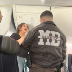 american-airlines-traveler-freaks-out-as-she’s-allegedly-kicked-off-plane-for-playing-videos-on-loudspeaker