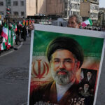 where-is-the-supreme-leader?-mojtaba-khamenei-cardboard-cutout,-silence-inspire-wild-rumors