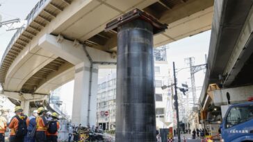 giant-pipe-mysteriously-bursts-through-ground,-rises-30-feet-above-road-in-japan