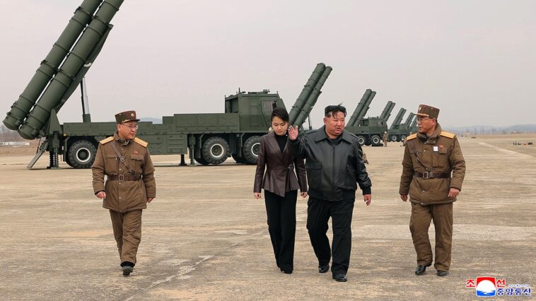 kim-jong-un-appears-with-teenage-daughter-at-live-fire-rocket-test-in-north-korea