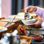 hotel-buffet-crashers-caught-on-camera-loading-up-plates,-walking-out-without-paying