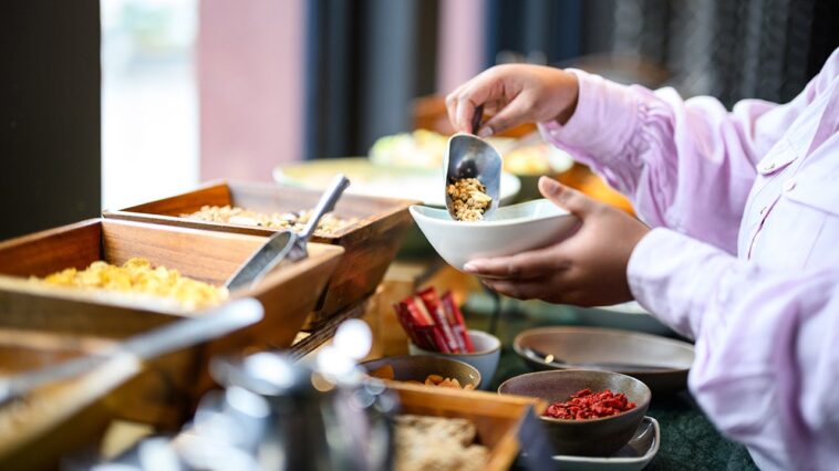 hotel-buffet-crashers-caught-on-camera-loading-up-plates,-walking-out-without-paying
