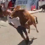 wild-moment-raging-bull-knocks-festivalgoer-out-with-a-flying-headbutt