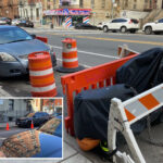 nyc-parking-wars-has-drivers-saving-spots-with-cones,-con-ed-barriers-and-even-derelict-e-bikes