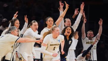 olson-leads-michigan-past-louisville-into-elite-8