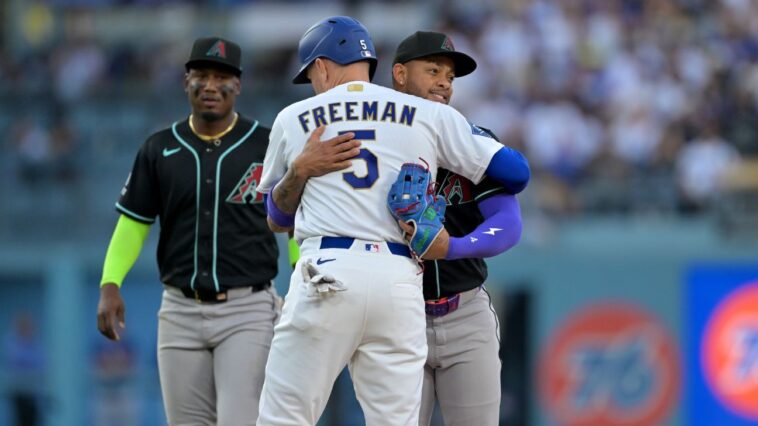 easily-out,-dodgers’-freeman-tagged-out-with-hug