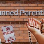 vermont-pro-life-prayer-group-attacked-with-spray-paint-while-praying-rosary-across-from-planned-parenthood,-our-lady-of-guadalupe-painting-vandalized-and-destroyed