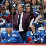 avalanche-head-coach-jared-bednar-hospitalized-after-taking-puck-to-face,-will-miss-road-trip
