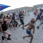 police-flood-orange-crush-island-hot-spot,-warn-of-teen-takeovers-as-beach-bash-madness-returns