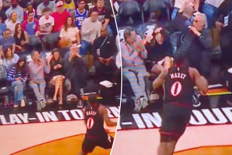 76ers-fan-pays-painful-price-for-staring-at-phone-from-front-row