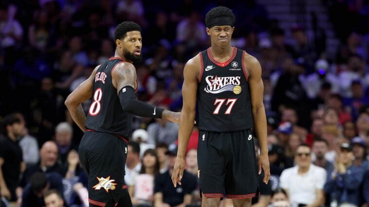 fan-drilled-with-errant-pass-while-on-her-phone-sitting-courtside-at-nba-play-in-tournament