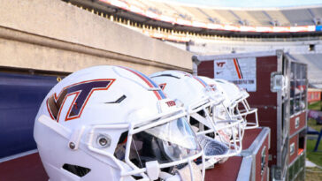 watch:-parachutist-left-dangling-after-crashing-into-scoreboard-at-virginia-tech-spring-game
