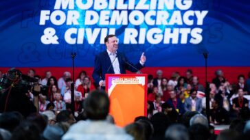 chris-murphy-and-tim-walz-cozy-up-to-wannabe-tyrants-at-communist-rally