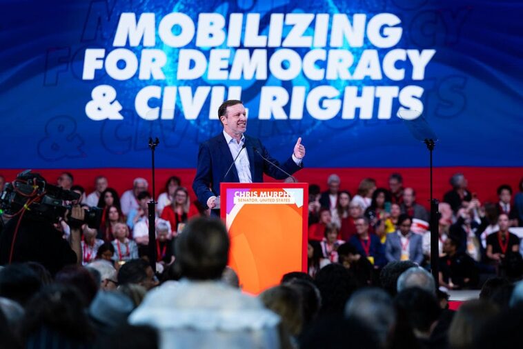 chris-murphy-and-tim-walz-cozy-up-to-wannabe-tyrants-at-communist-rally