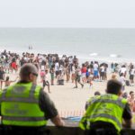 orange-crush-beach-blowout-nets-26-arrests,-cops-seize-makeshift-machine-gun-as-massive-crowd-tests-crackdown