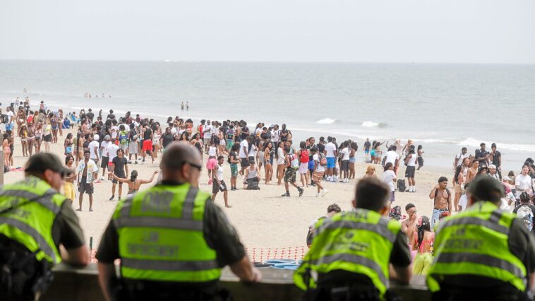 orange-crush-beach-blowout-nets-26-arrests,-cops-seize-makeshift-machine-gun-as-massive-crowd-tests-crackdown