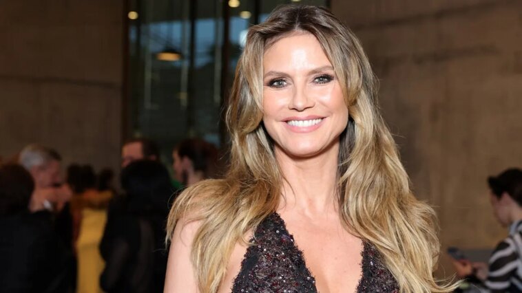 heidi-klum-stuns-in-black-triangle-bikini-during-relaxing-poolside-moment