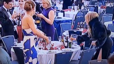 woman-seen-snatching-wine-bottles-during-chaos-after-white-house-correspondents’-dinner-shooting