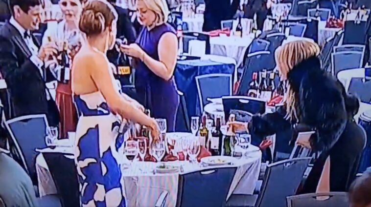 woman-seen-snatching-wine-bottles-during-chaos-after-white-house-correspondents’-dinner-shooting