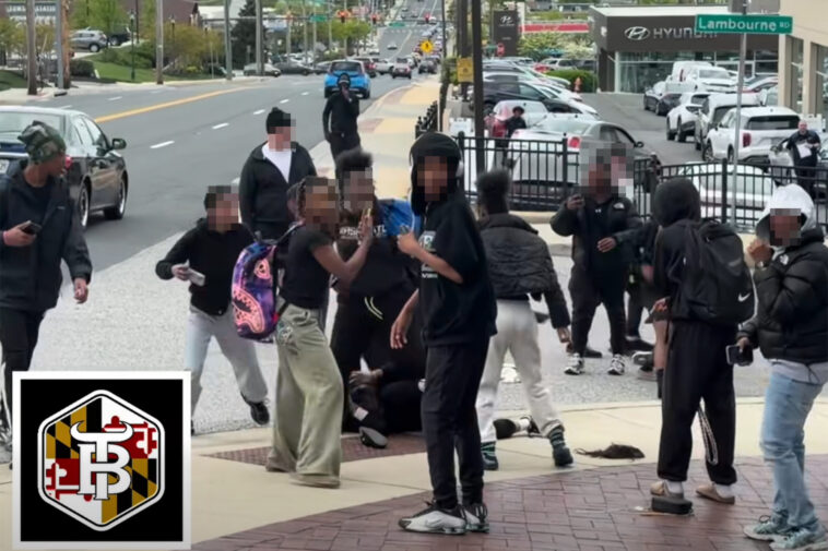 swarm-of-middle-schoolers-laugh,-smile-at-camera-as-brawling-peers-stomp-on-victim-in-wild-street-fight