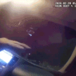 body-camera-video-shows-police-officer-allegedly-kidnapped-by-armed-robbery-suspect-in-roadside-showdown