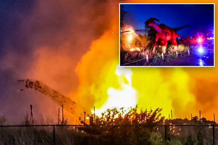 lightning-strike-turns-100-foot-dinosaur-into-raging-fireball,-stunning-onlookers