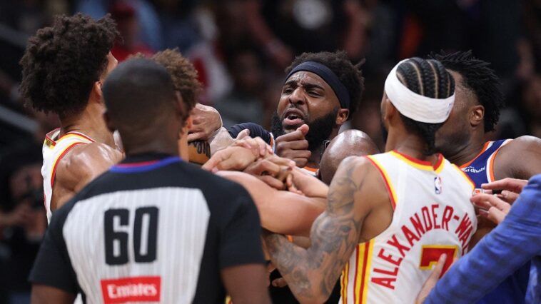 two-players-ejected-after-scrum-amid-knicks’-50-point-lead-against-hawks-sends-referee-crashing-to-the-court