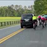 watch:-driver-smirks-in-mugshot-after-allegedly-hitting-group-of-cyclists-in-caught-on-camera-road-rage