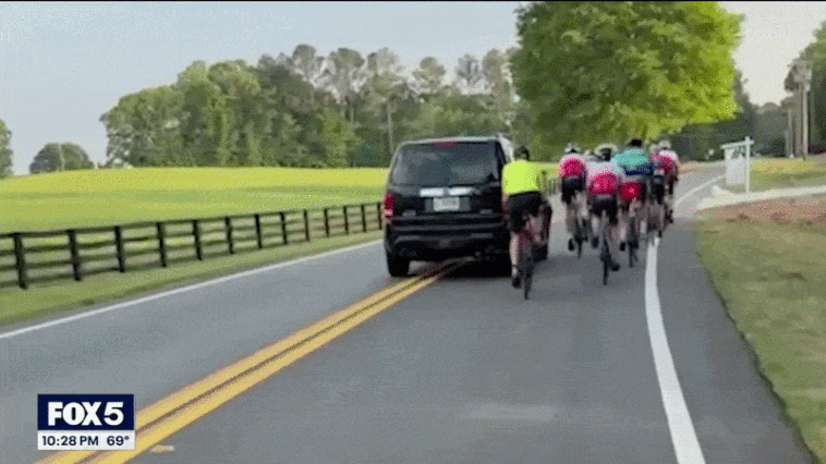 watch:-driver-smirks-in-mugshot-after-allegedly-hitting-group-of-cyclists-in-caught-on-camera-road-rage