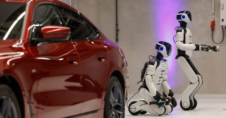 car-company-puts-human-like-robots-on-their-production-line