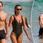brooks-nader-flaunts-plunging-swimsuit-during-steamy-beach-date-with-actor-taron-egerton-in-australia