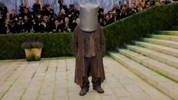 hobo-with-garbage-can-stuck-on-his-head-mistaken-for-met-gala-attendee