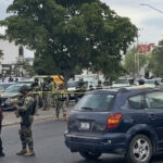 mexican-soldiers-watch-as-cartel-gunmen-attack-funeral-procession
