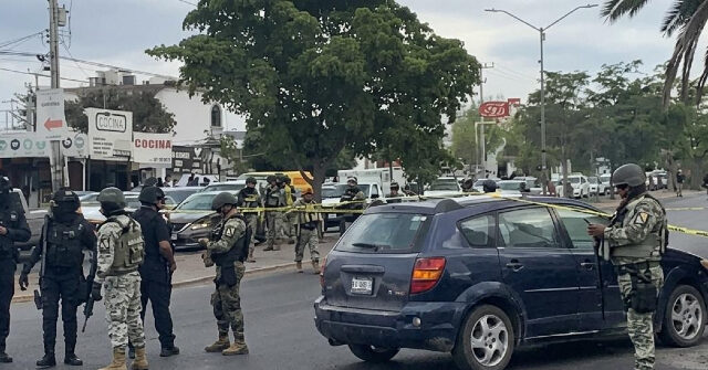 mexican-soldiers-watch-as-cartel-gunmen-attack-funeral-procession