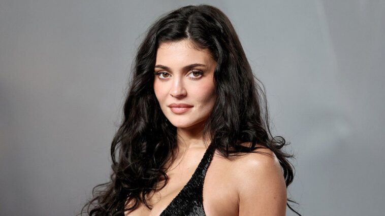 kylie-jenner-poses-soaking-wet-in-black-bikini-for-steamy-makeup-promotional-shoot