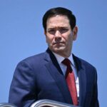 marco-rubio-spotted-in-nike-tracksuit-aboard-air-force-one-during-trip-to-china,-igniting-memes-online